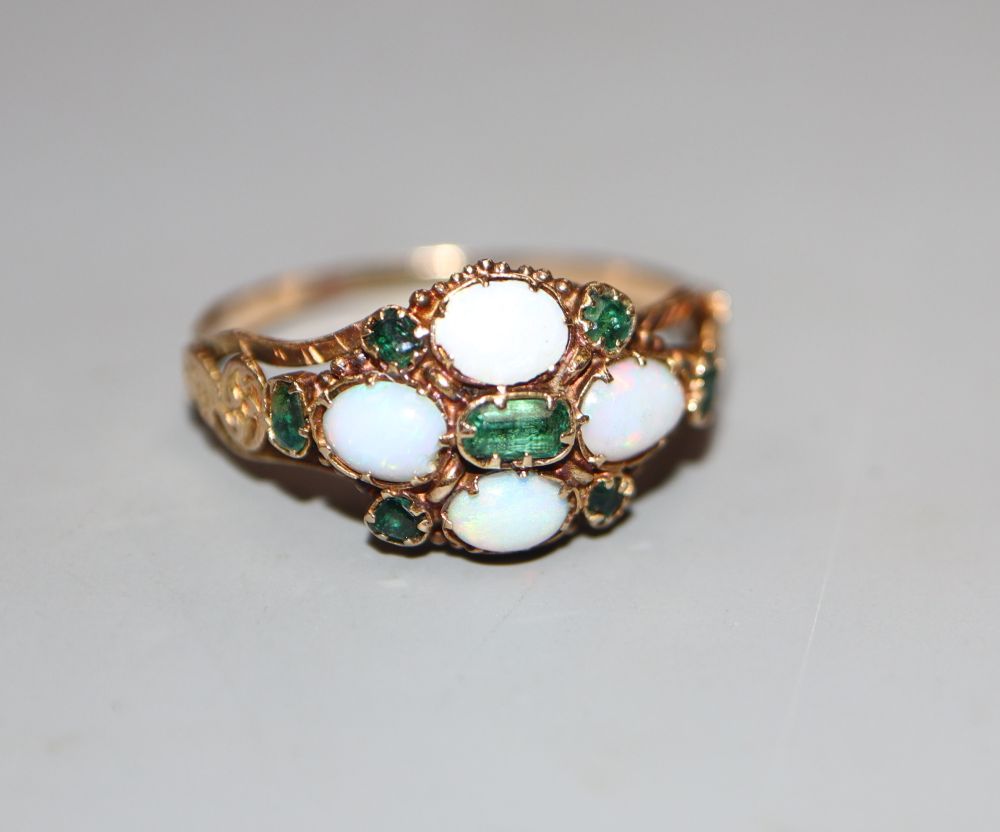 A Victorian yellow metal, white opal and emerald set cluster ring, size N/O, gross 25 grams.